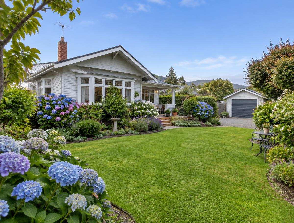 Established garden with hydrangeas and detached garage